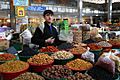 Young Tajikistani dry fruit seller