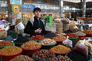 Young Tajikistani dry fruit seller