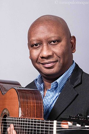 Ron Jackson headshot with guitar.jpg