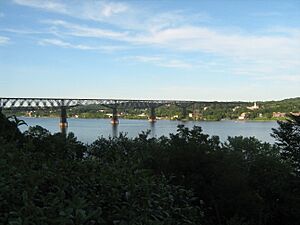 Walkway over the Hudson with the City of Poughkeepsie in the background and the Hudson River in the foreground.