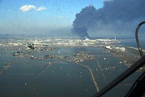 SH-60B helicopter flies over Sendai