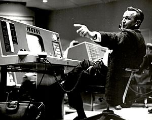 Christopher Kraft, flight director during Project Mercury, works at his console inside the Flight Control area at Mercury Mission Control