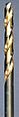 A steel colored twist drill bit with the spiral groove colored in a golden shade.