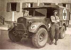 Friends Ambulance Unit ambulance driver, with his vehicle in Wolfsburg, Germany