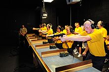 US Navy 100923-N-7682A-014 Navy Junior ROTC cadets from Hamilton High School, Ohio, practice marksmanship at the Fire Arms Training Simulator (FATS