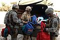 301st PSYOP Company, USAR, Calif., and 3-7 Cavalry, Fort Stewart, Ga., soldiers give away school supplies in Safia Bint Abdul Mutaleb School in 2007