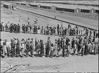 Dorothea Lange - American internees in mess hall line at Tanforan Assembly Center San Bruno CA April 29 1942