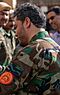 Yasin Zia greeting troops (cropped).jpg