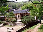 Traditional Korean buildings surrounded by trees