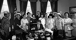 American Association of University Women members with President John F. Kennedy as he signs the Equal Pay Act into law