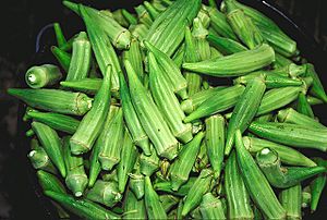 Bucket of raw okra pods