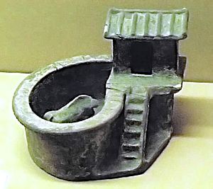 Green glazed toilet with pigsty model. Eastern Han dynasty 25 - 220 CE