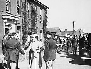 HM King George VI and Queen Elizabeth are greeted by Brigadier Frank Hunter and Major General Ira Eaker of the 8th US Army Air Forces on a visit to Duxford, 26 May 1943. CH19214