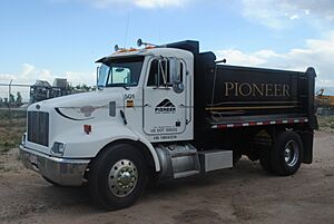 Peterbilt 330 dump with dirt tub dump body