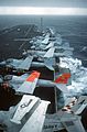 Several A-6 aircraft parked with EA-6 and S-3 aboard CV-67