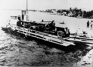 StateLibQld 2 112856 Naval gun being ferried across to Bribie Island, 1939