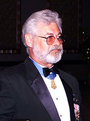 Sergeant Major Jon R. Cavaiani proudly displays his Medal of Honor at the Marine Corps Law Enforcement Foundation's 10th Annual Gala on June 12, 2004.