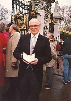 T S WEST 1987 CBE