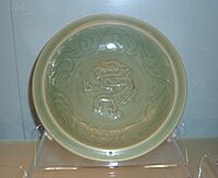 Celadon dish with applied dragon design