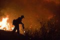 Crew member setting fire back burn