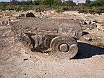 Ancient stone capital with fern-like relief at the archaeological site of Dvin