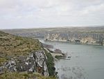 A large river flows through a canyon.