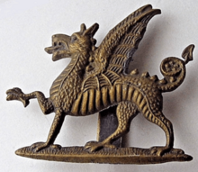 Monmouthshire Regiment cap badge.png