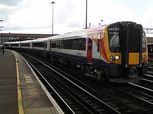 444016 passing through Clapham Junction