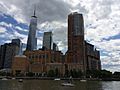 A southward view of Stuyvesant High School from Hudson River Park. The Hudson River is seen at right, and the skyscrapers of the new World Trade Center can be seen in the background.