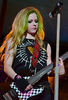 Avril Lavigne playing guitar, St. Petersburg (crop)