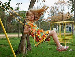 Little girl on swing