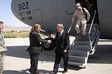 Mr. Richard B. Norland (center, left), Charge'd'Affairs, American Embassy in Kabul, welcomes the Honorable Donald H. Rumsfeld (center, right), U.S. Secretary of Defense, to Kabul, K - DPLA - 90b795572521712a8daa4a904d20dff6