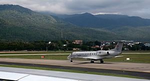 RTN Embraer ERJ 135LR beneath Wat Doi Suthep