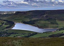 A lake deep in a valley surrounded by hills