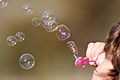 Girl blowing bubbles