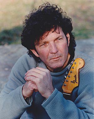 Tony Joe White with guitar.jpg