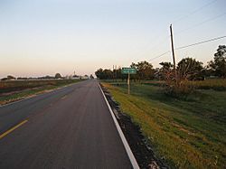 The view southeast shows open fields along FM 361.