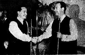 photo of two men shaking hands.