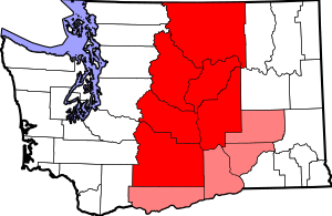 Map of Central Washington. Counties highlighted in red are always included, while counties highlighted in pink are sometimes included.