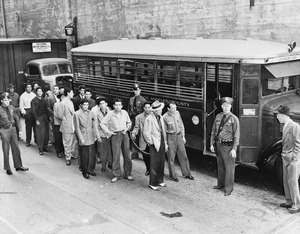 Zoot suiters lined up outside Los Angeles jail en route to court after feud with sailors