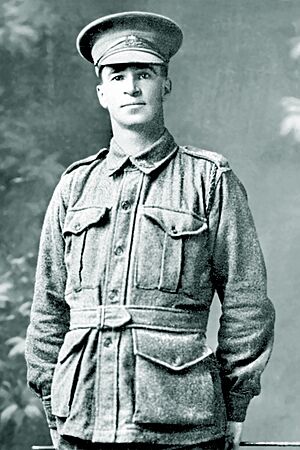 a black and white 3/4 portrait of a male in uniform