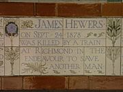 A tablet formed of five tiles of varying sizes, bordered by yellow and blue flowers in an art nouveau style