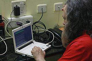 Richard Matthew Stallman working on his Lemote Machine