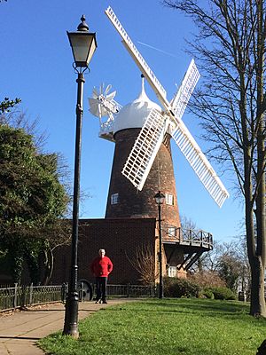 Green's Mill, Sneinton, Nottingham, with material pulled back on two and flaps open on other wind blades