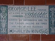 A tablet formed of six standard sized tiles, bordered by green flowers in the style of the Arts and Crafts movement