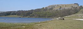 Image of an upland lake surrounded by hills and trees