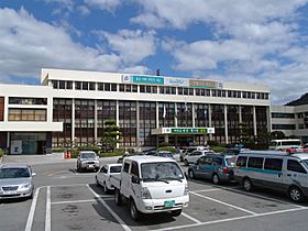 A collection of six photographs of famous things in Gyeongju. The first row shows tumuli and trees. The second row consists of three images; from left to right, a stone observatory, a seated stone Buddha statue, and a modern glass tower are arranged. At right on the third row, a photo of a colorful wooden building with a stone bridges is shown. At left, a pavilion reflecting the image on a pond is shown.