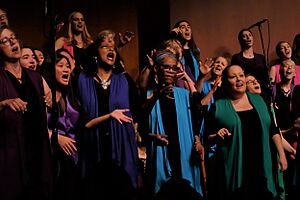 Photo of concert with emotive singers