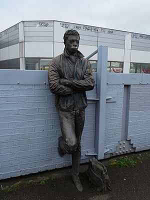 Male statue, Brixton railway station in March 2011 01
