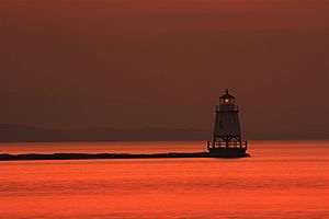 The light house in lake Champlain in the dusk as seen from Burlington VT.